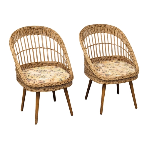 644 - A pair of Mid Century wicker tub chairs. 1970s  (4)