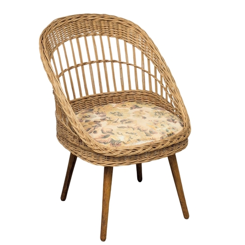 644 - A pair of Mid Century wicker tub chairs. 1970s  (4)