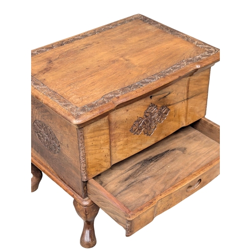 645 - A vintage carved olive wood sewing box. 47x33x38cm. 10