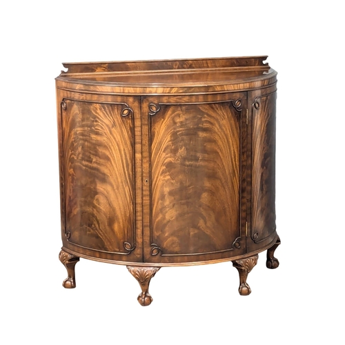 655 - A Georgian style mahogany demi lune side cabinet on Ball & Claw feet. 110x49x106.5cm. 3