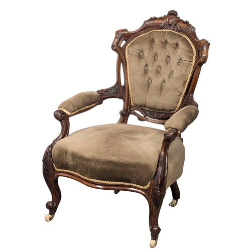 661 - An 19th Century Victorian walnut open armchair on Cabriole legs. 2