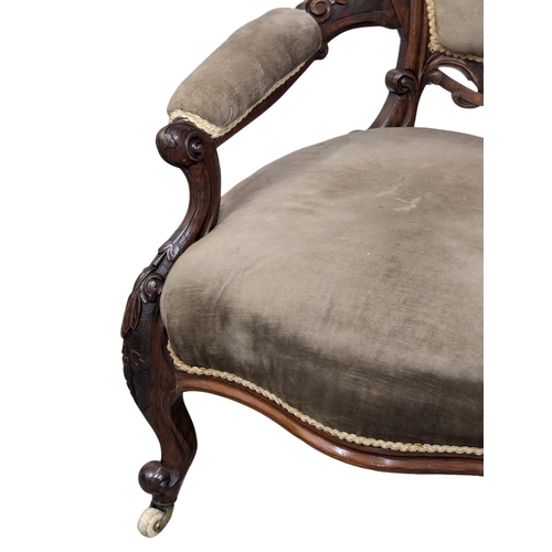 661 - An 19th Century Victorian walnut open armchair on Cabriole legs. 2