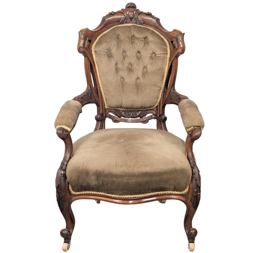 661 - An 19th Century Victorian walnut open armchair on Cabriole legs. 2