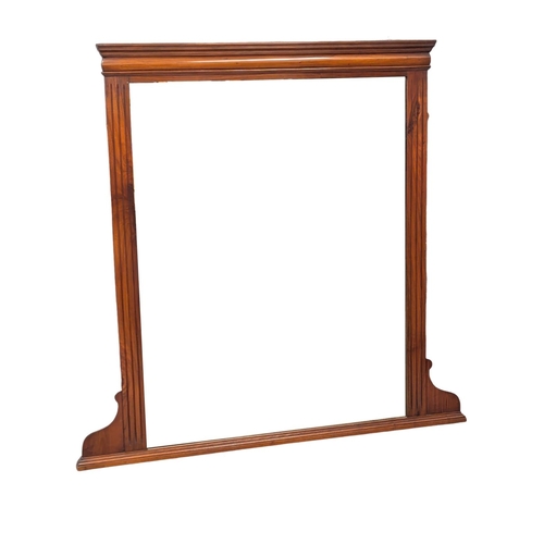 693 - A large Late Victorian walnut over-mantle mirror. 142x137cm (6)