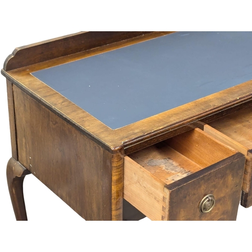 694 - A 1930s walnut writing desk. 110x51x84cm. 3