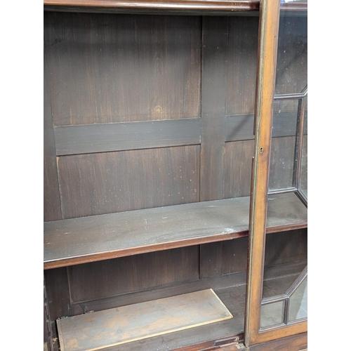 700 - A large George III mahogany bookcase. Marriage. Restoration needed. 129x40x219cm (5)