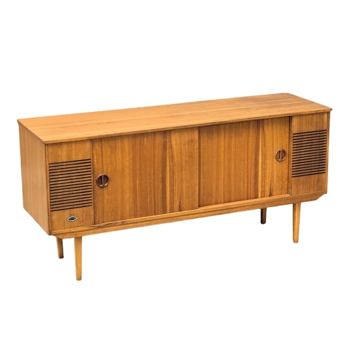 709 - A Mid Century teak radiogram. 128x38.5x61.5cm. 3