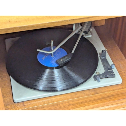 709 - A Mid Century teak radiogram. 128x38.5x61.5cm. 3