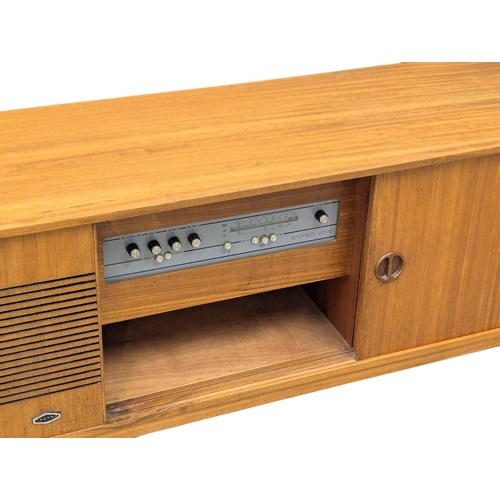 709 - A Mid Century teak radiogram. 128x38.5x61.5cm. 3