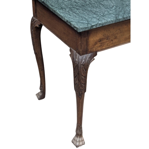 72 - A Late 18th Century mahogany side table raised on four lion paw feet with later marble top. George I... 