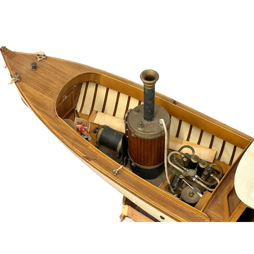 767 - 2 large motorised boats. A Victorian style steamboat and a yacht. 128cm. 106cm