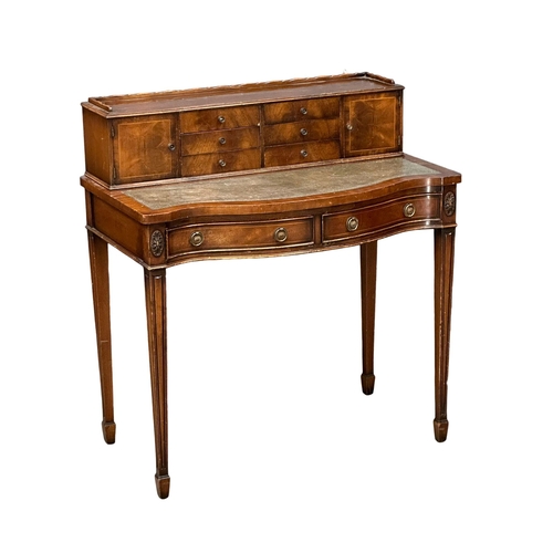 812 - A Hepplewhite style mahogany serpentine front writing table, with leather top. 90.5x55x108cm. (10)