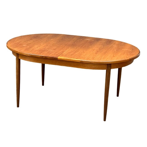 87 - A G-Plan “Fresco” Mid Century teak extending dining table and 6 chairs. Designed by Victor Wilkins. ... 