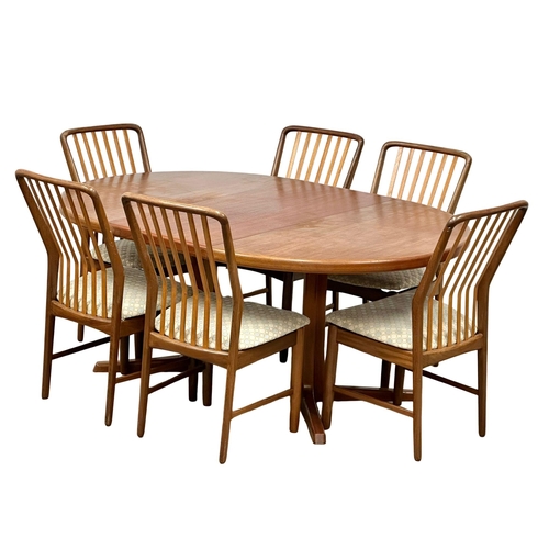 9 - Svend Aage Madsen. A good quality Danish Mid Century teak extending, 2 leaf dining table and 6 chair... 