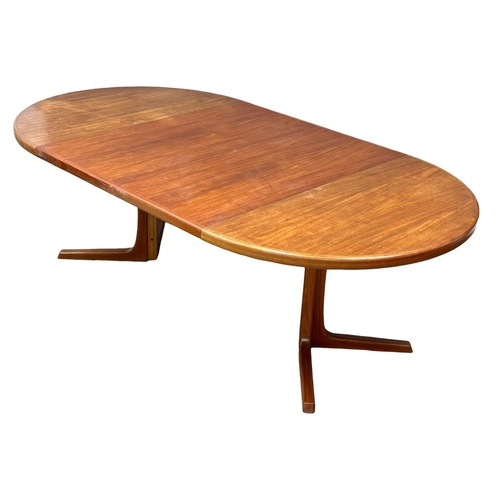 9 - Svend Aage Madsen. A good quality Danish Mid Century teak extending, 2 leaf dining table and 6 chair... 