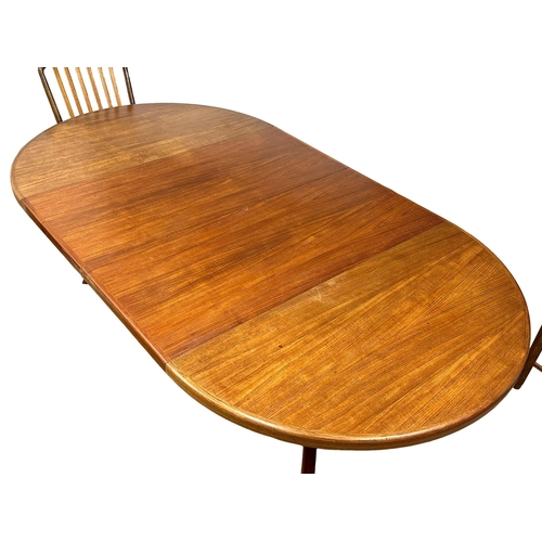 9 - Svend Aage Madsen. A good quality Danish Mid Century teak extending, 2 leaf dining table and 6 chair... 