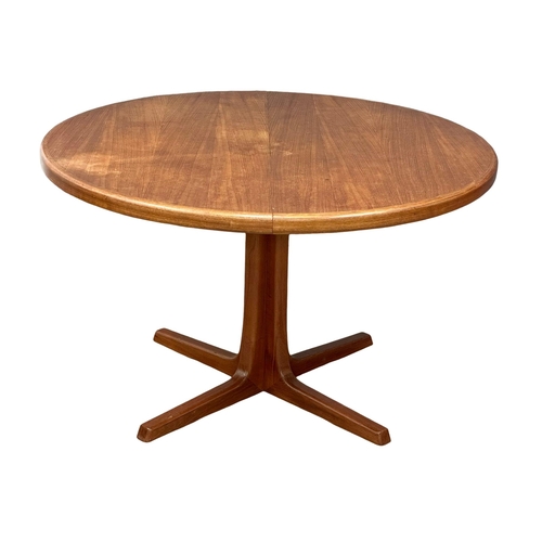 9 - Svend Aage Madsen. A good quality Danish Mid Century teak extending, 2 leaf dining table and 6 chair... 