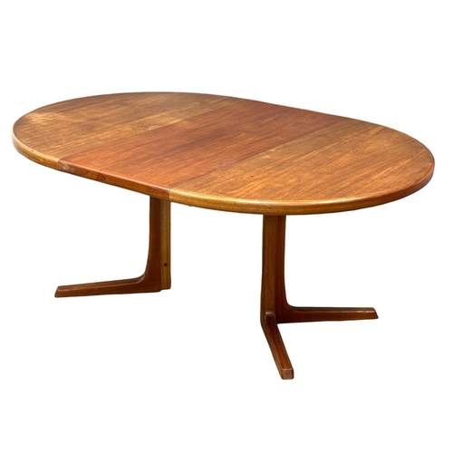 9 - Svend Aage Madsen. A good quality Danish Mid Century teak extending, 2 leaf dining table and 6 chair... 