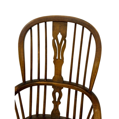 91 - A Late 19th Century elm Windsor chair.