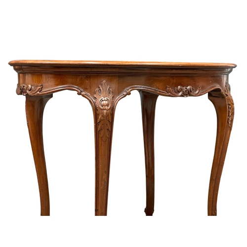 918 - An Early 20th Century French mahogany centre table, on cabriole legs. 102x68x74cm (11)