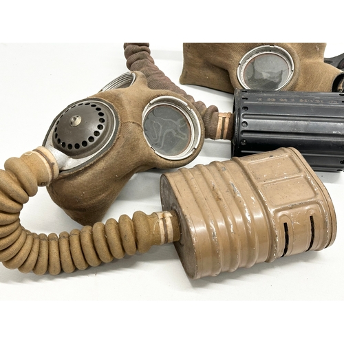 739 - Two WWII gas masks. Barringer Wallis. Dated 1939