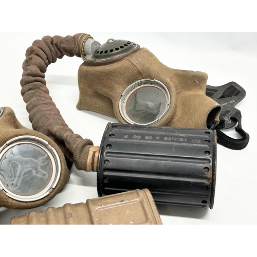 739 - Two WWII gas masks. Barringer Wallis. Dated 1939