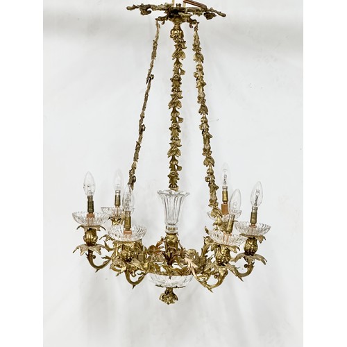 63 - A good quality Early 20th Century French brass and crystal, rococo style chandelier, with 6 branches... 