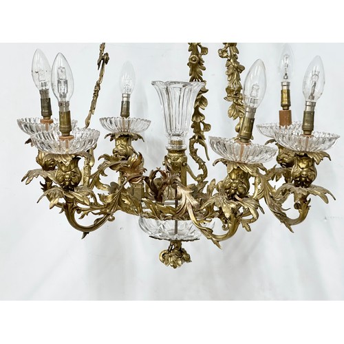 63 - A good quality Early 20th Century French brass and crystal, rococo style chandelier, with 6 branches... 