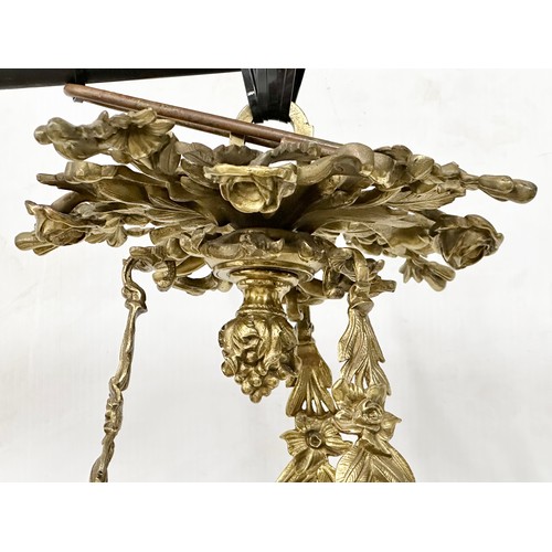 63 - A good quality Early 20th Century French brass and crystal, rococo style chandelier, with 6 branches... 