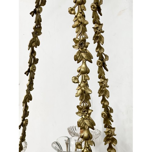 63 - A good quality Early 20th Century French brass and crystal, rococo style chandelier, with 6 branches... 