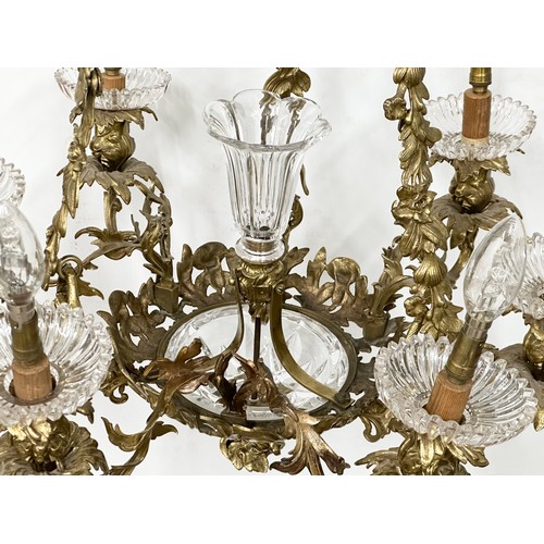 63 - A good quality Early 20th Century French brass and crystal, rococo style chandelier, with 6 branches... 