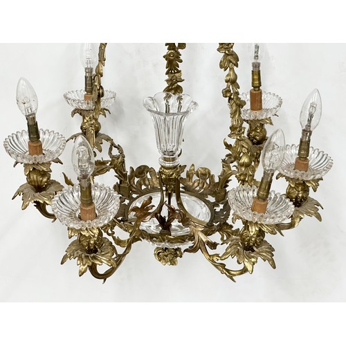 63 - A good quality Early 20th Century French brass and crystal, rococo style chandelier, with 6 branches... 