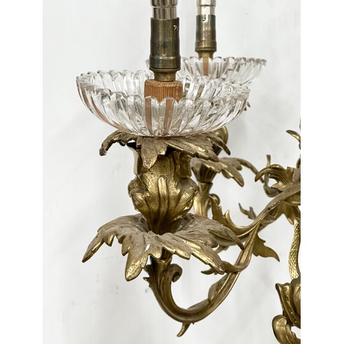 63 - A good quality Early 20th Century French brass and crystal, rococo style chandelier, with 6 branches... 