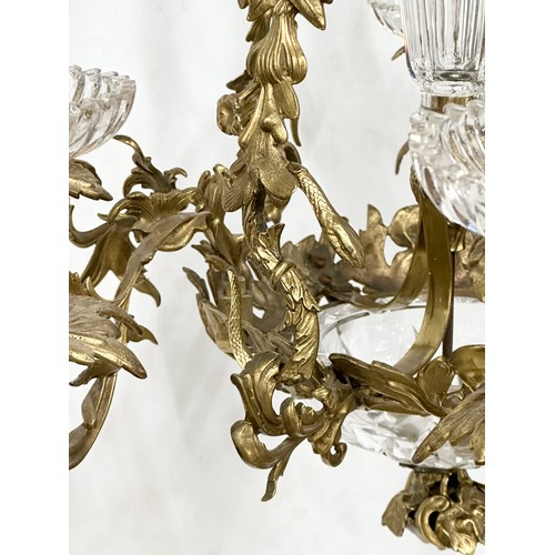 63 - A good quality Early 20th Century French brass and crystal, rococo style chandelier, with 6 branches... 