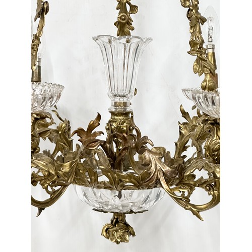 63 - A good quality Early 20th Century French brass and crystal, rococo style chandelier, with 6 branches... 