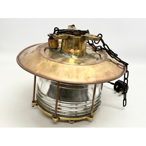 298 - A large Early 20th Century Ships Lantern Nautical brass ceiling light. Lantern measures 37x32cm.