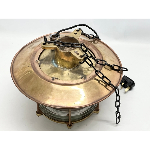 298 - A large Early 20th Century Ships Lantern Nautical brass ceiling light. Lantern measures 37x32cm.