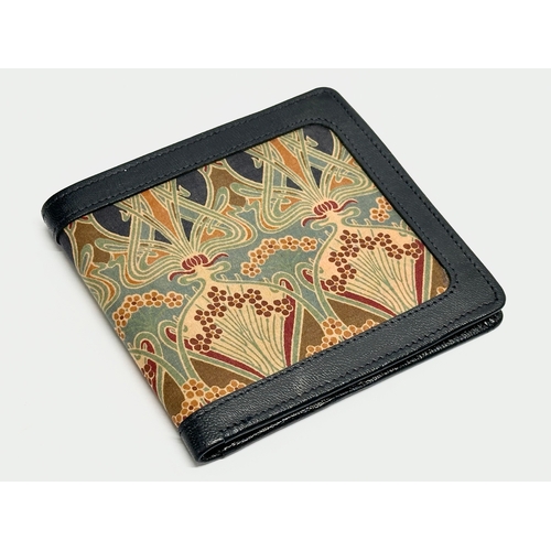 299 - A leather Liberty wallet.