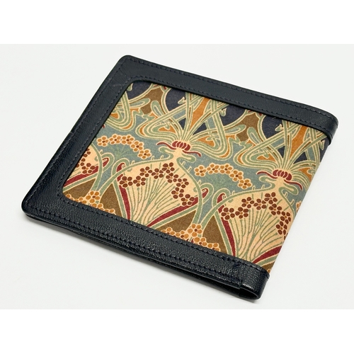 299 - A leather Liberty wallet.