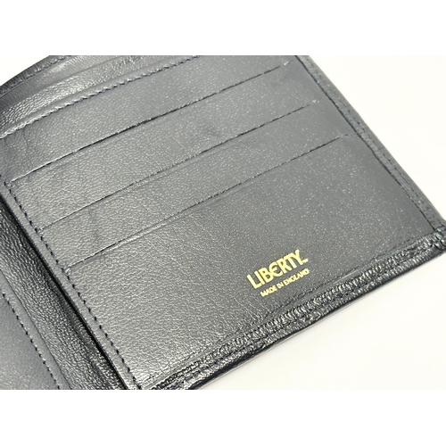 299 - A leather Liberty wallet.