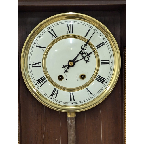 454 - A large Victorian style Vienna wall clock with double weights and pendulum. 120cm