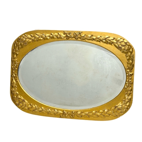 301 - An Early 20th Century gilt framed mirror, with bevelled glass. Circa 1900-1920. 87x62cm.