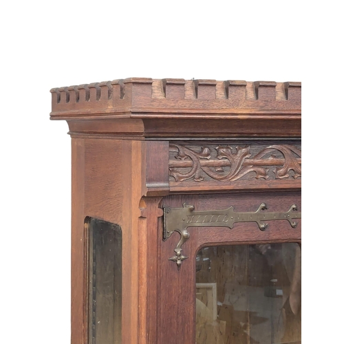 920A - A Late 19th Century oak court cabinet. 102x48.5x171cm. 9