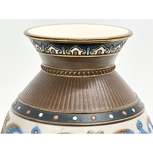 131 - Villeroy & Boch. A Late 19th Century German earthenware Mettlach vase with embossed Islamic style de... 