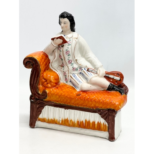 133 - A pair of 19th Century Victorian Staffordshire Pottery chaise lounge bookends/figurines. Circa 1850-... 