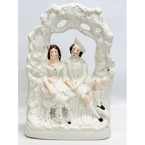 135 - A pair of 19th Century Victorian Staffordshire Pottery “Courting Couple” figurines. Bride & Groom. C... 