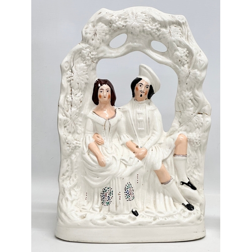 135 - A pair of 19th Century Victorian Staffordshire Pottery “Courting Couple” figurines. Bride & Groom. C... 