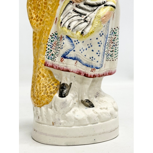 136 - A 19th Century Victorian Staffordshire Pottery “Fishmonger” figurine. Circa 1860-1870. 33.5cm.