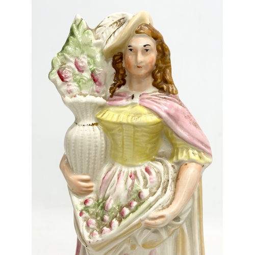 137 - A rare 19th Century Victorian Staffordshire Pottery “Flower” figurine. Late 19th Century. 30.5cm