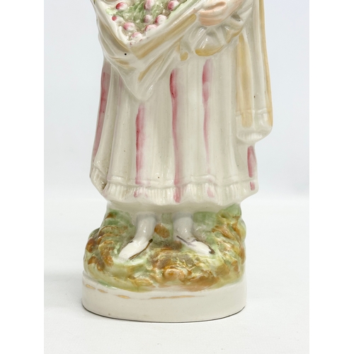 137 - A rare 19th Century Victorian Staffordshire Pottery “Flower” figurine. Late 19th Century. 30.5cm